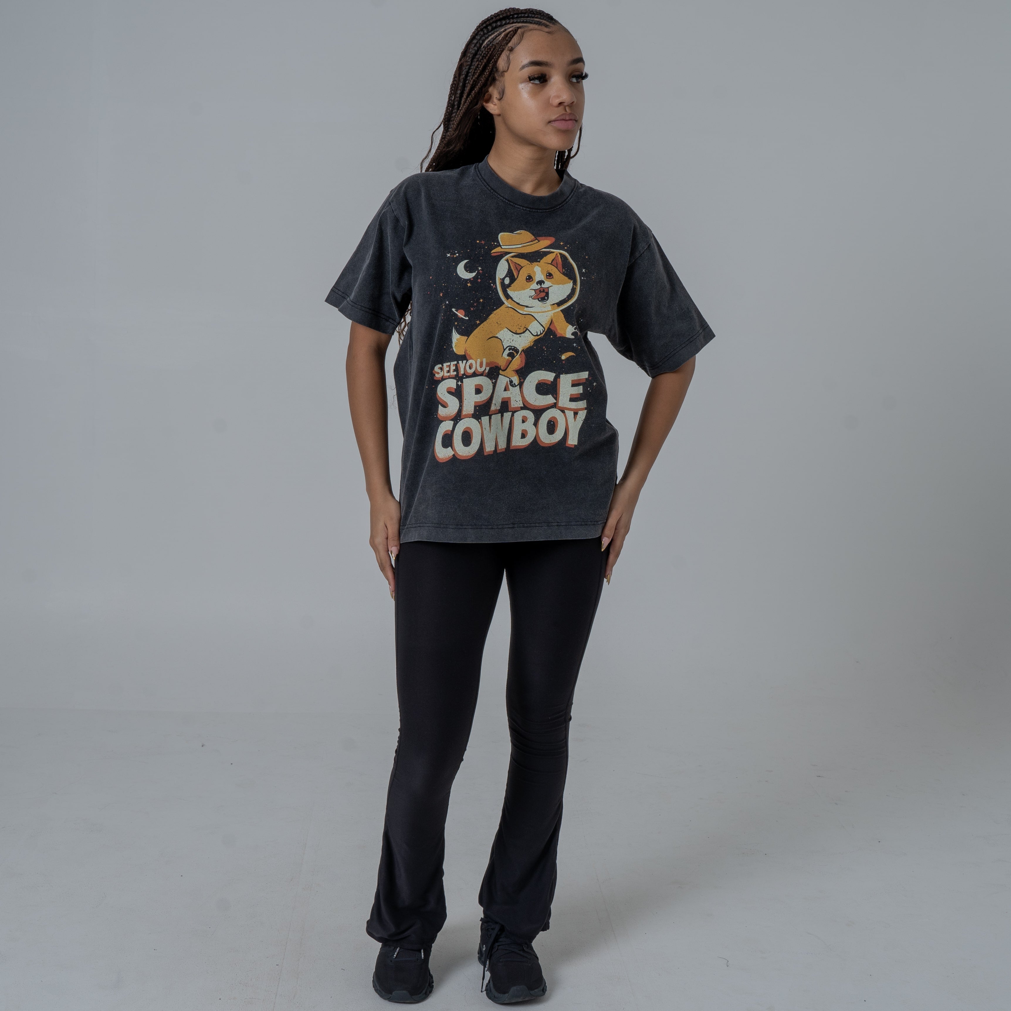 Full Body Shot of a Model Wearing Black Vintage Washed Shirt Featuring Ein From Cowboy Bebop Anime with See You Space Cowboy Text.